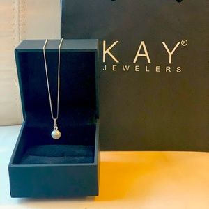 A freshwater cultured pearl and shimmering lab-created white sapphires